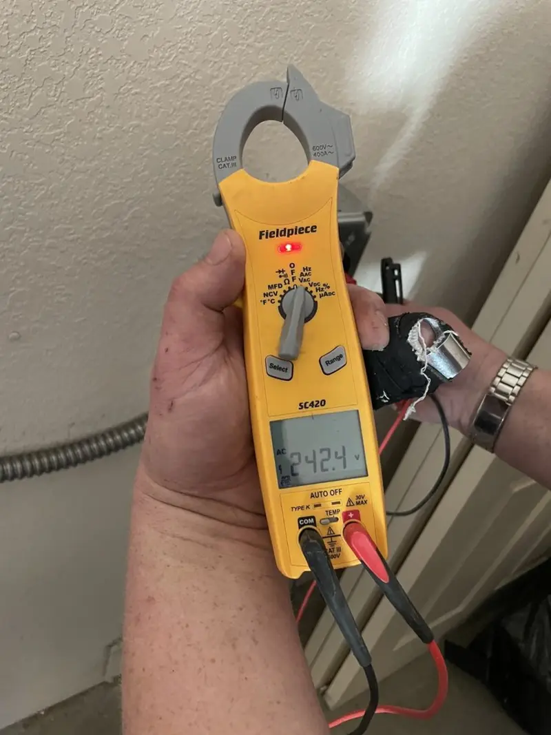 Voltage testing with clamp meter during Generator Installation in Decatur